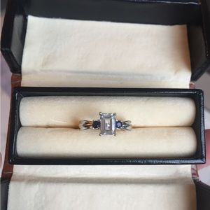 White Gold Aquamarine Emerald cut ring with sapphires.